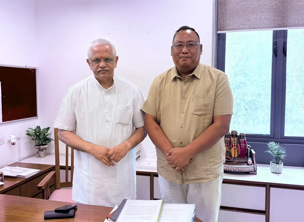 Benjamin Yepthomi standing with BJP National General Secretary (Organisation) B. L. Santhosh in an office at the party headquarters in New Delhi.
